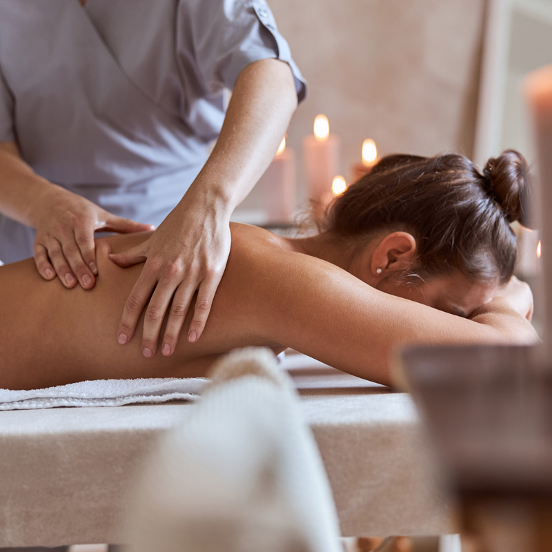 young atractive female massage salon is having beauty healthcare procedures